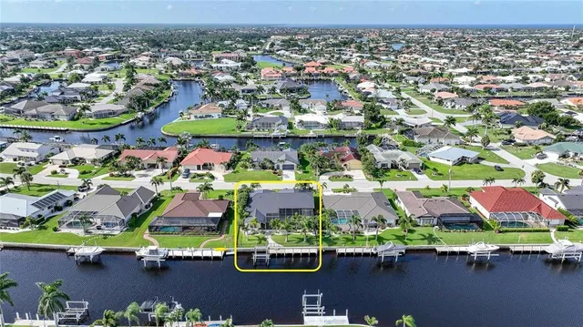 an aerial view of a swimming pool and outdoor space