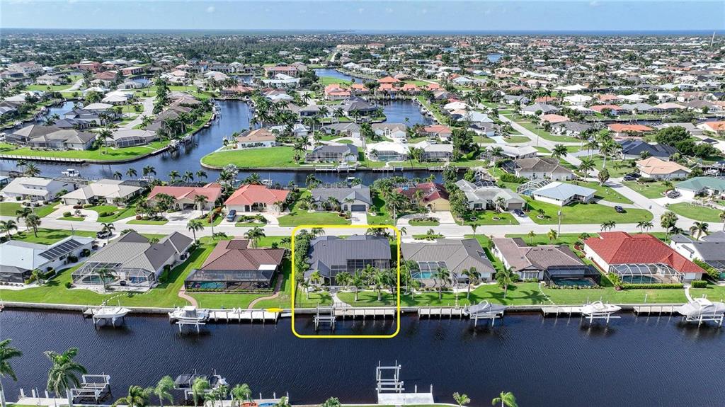822 Vía Formia Punta Gorda, FL 33950 - Photo 28 of 33 an aerial view of a swimming pool and outdoor space