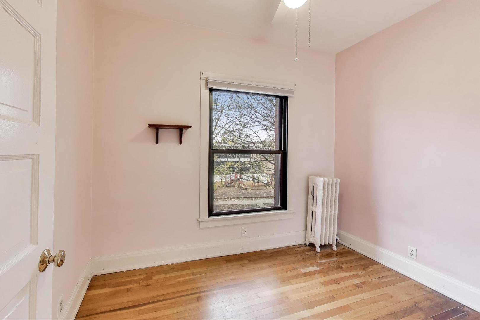 847 Judson Avenue, Unit 2 Evanston, IL 60202 - Photo 13 of 19 an empty room with windows