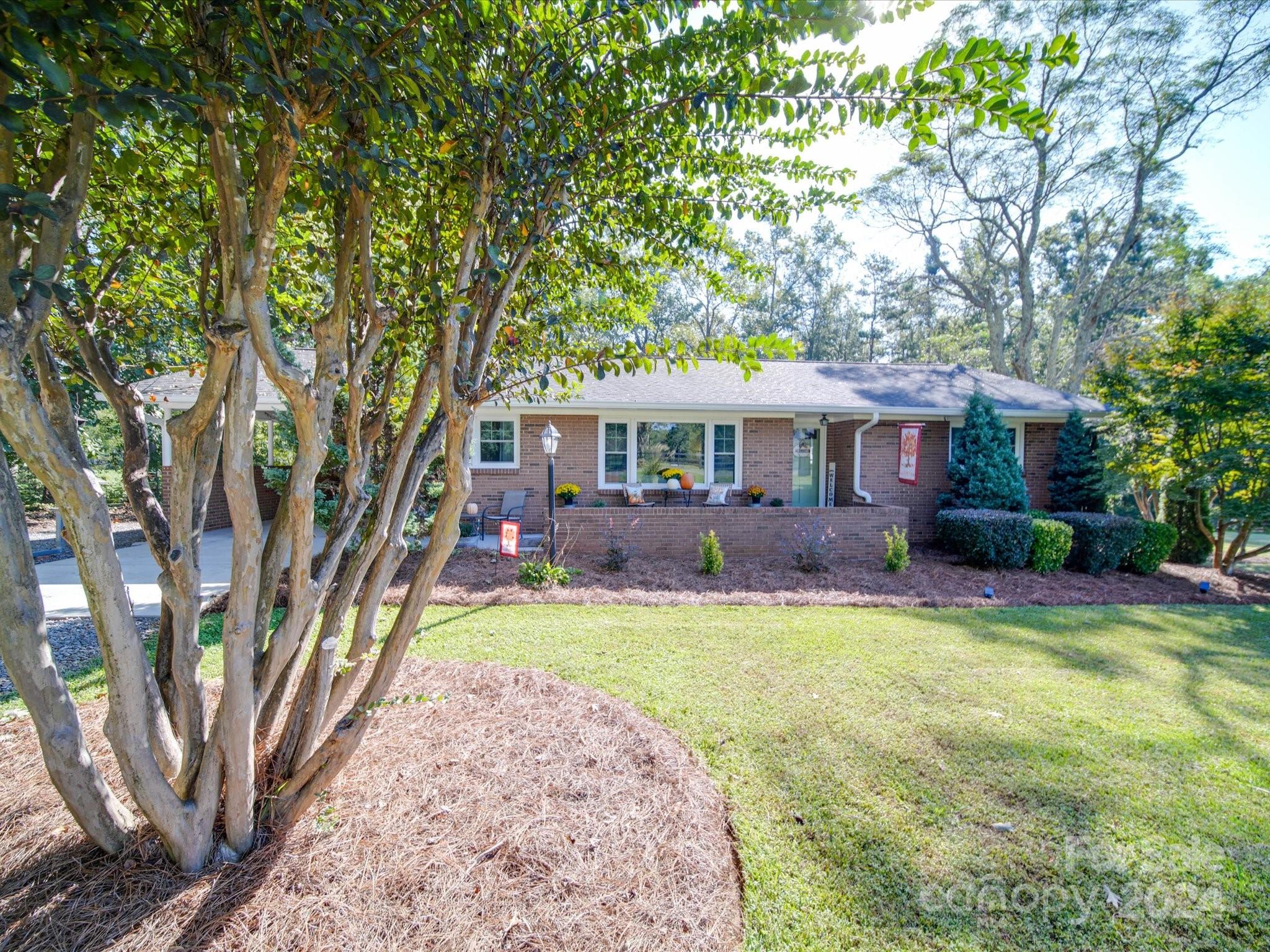 4904 Bud Wilson Road Gastonia, NC 28056 - Photo 2 of 45 a front view of a house with a yard