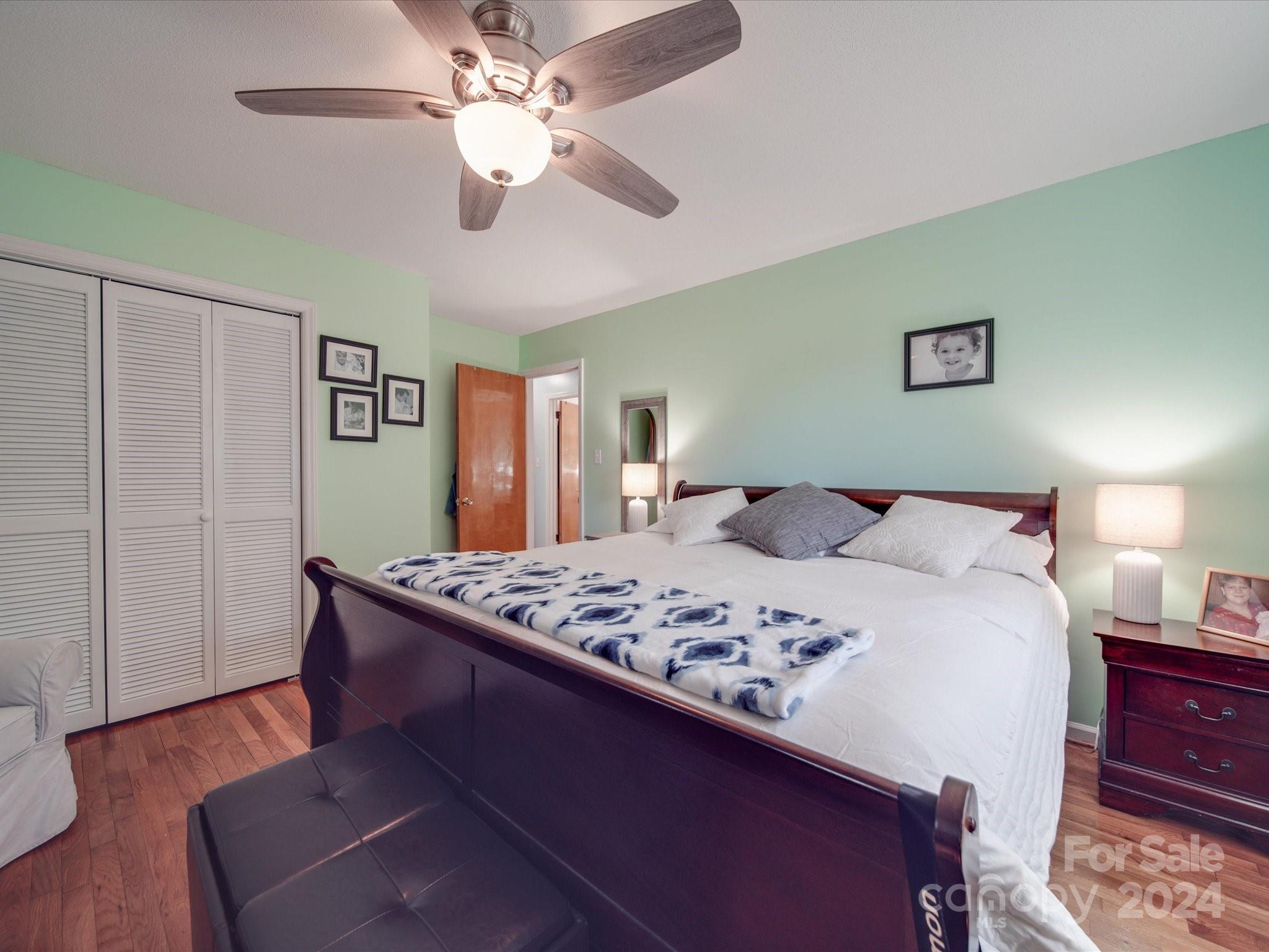 4904 Bud Wilson Road Gastonia, NC 28056 - Photo 23 of 45 a bedroom with a bed and a chandelier
