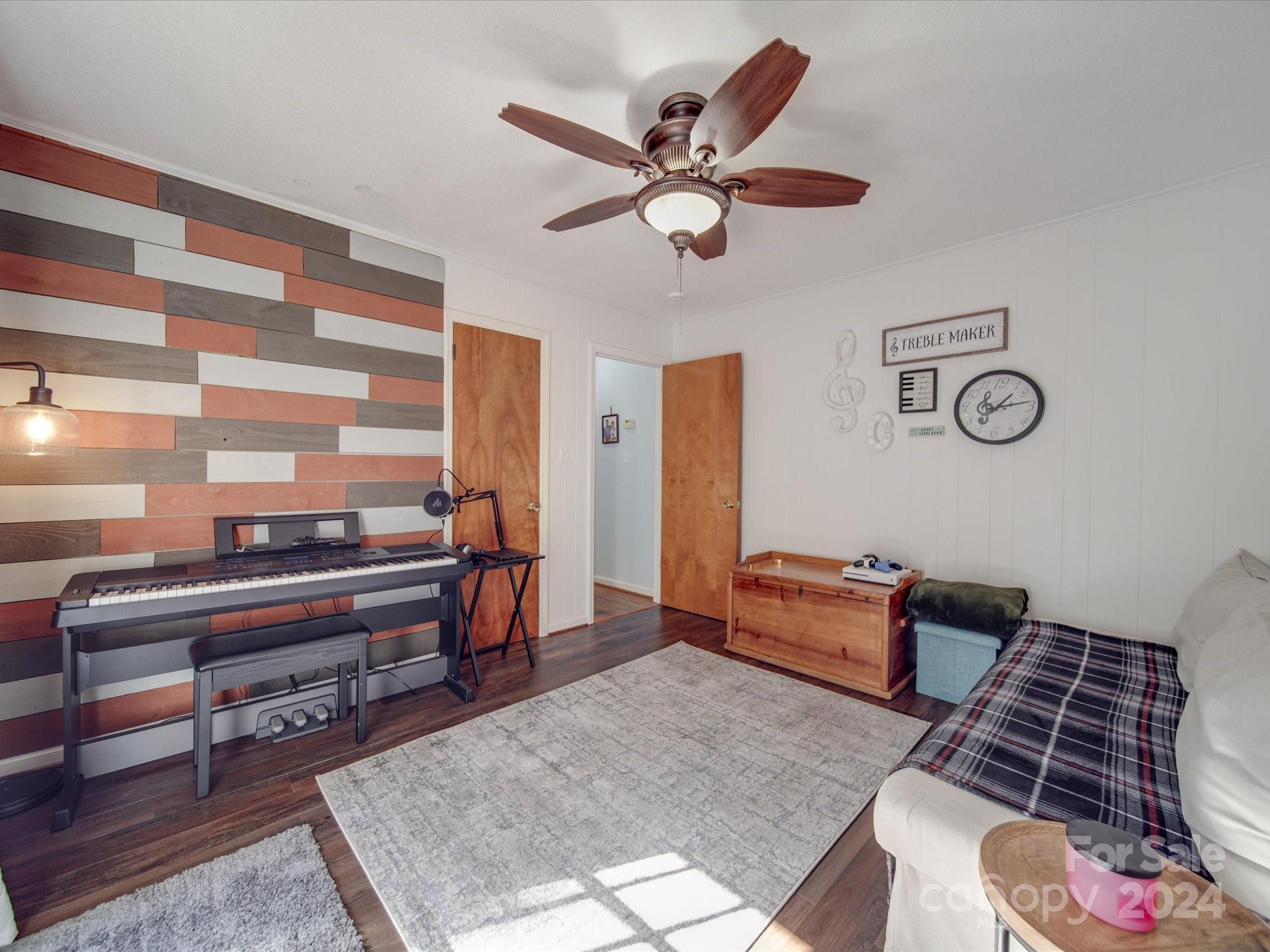 4904 Bud Wilson Road Gastonia, NC 28056 - Photo 29 of 45 a living room with furniture and a rug