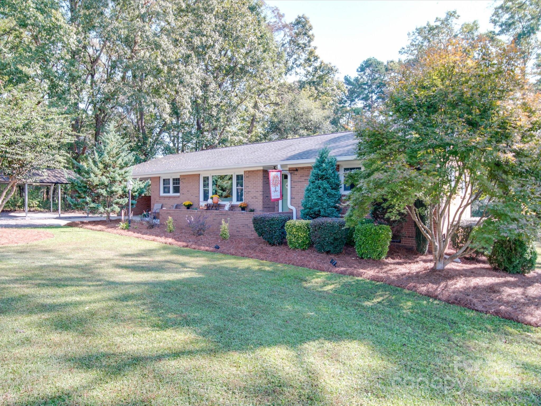 4904 Bud Wilson Road Gastonia, NC 28056 - Photo 3 of 45 a view of a house with a yard porch and sitting area