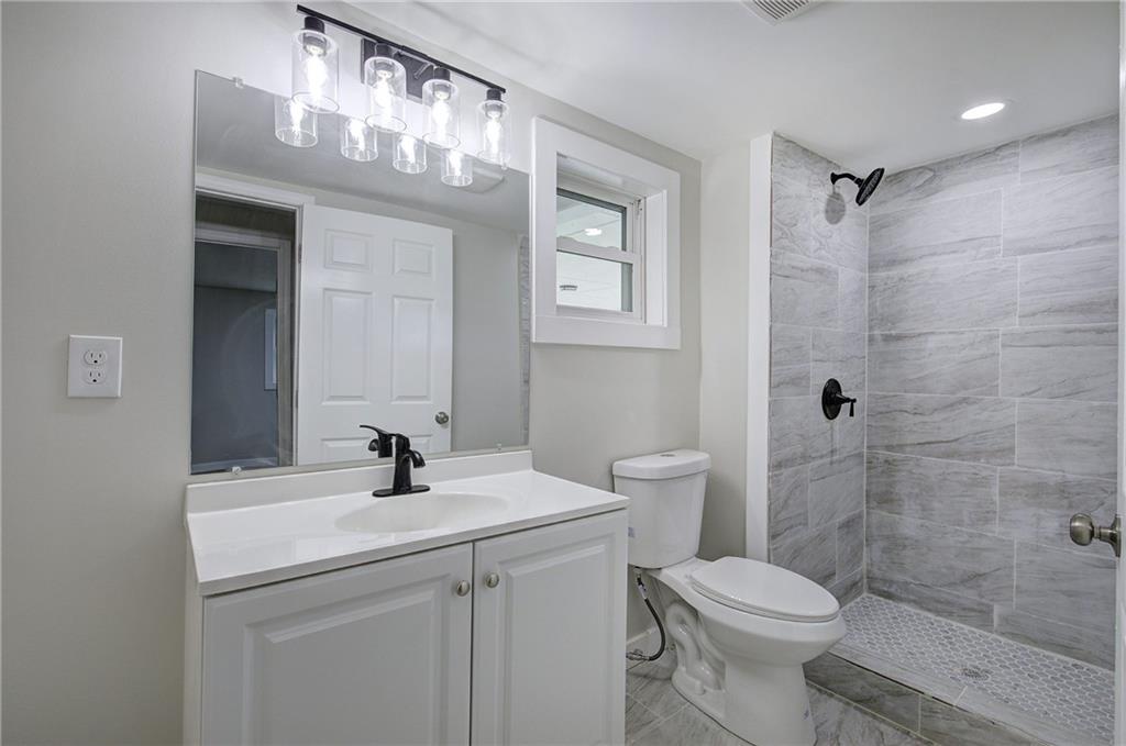 4604 Highway 151 LaFayette, GA 30728 - Photo 3 of 30 a bathroom with a sink a toilet and shower