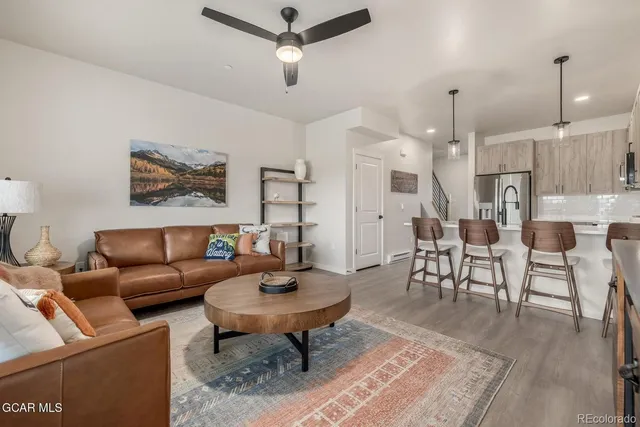 a kitchen with a stove a sink and a refrigerator