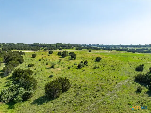 a view of a garden with an outdoor seating