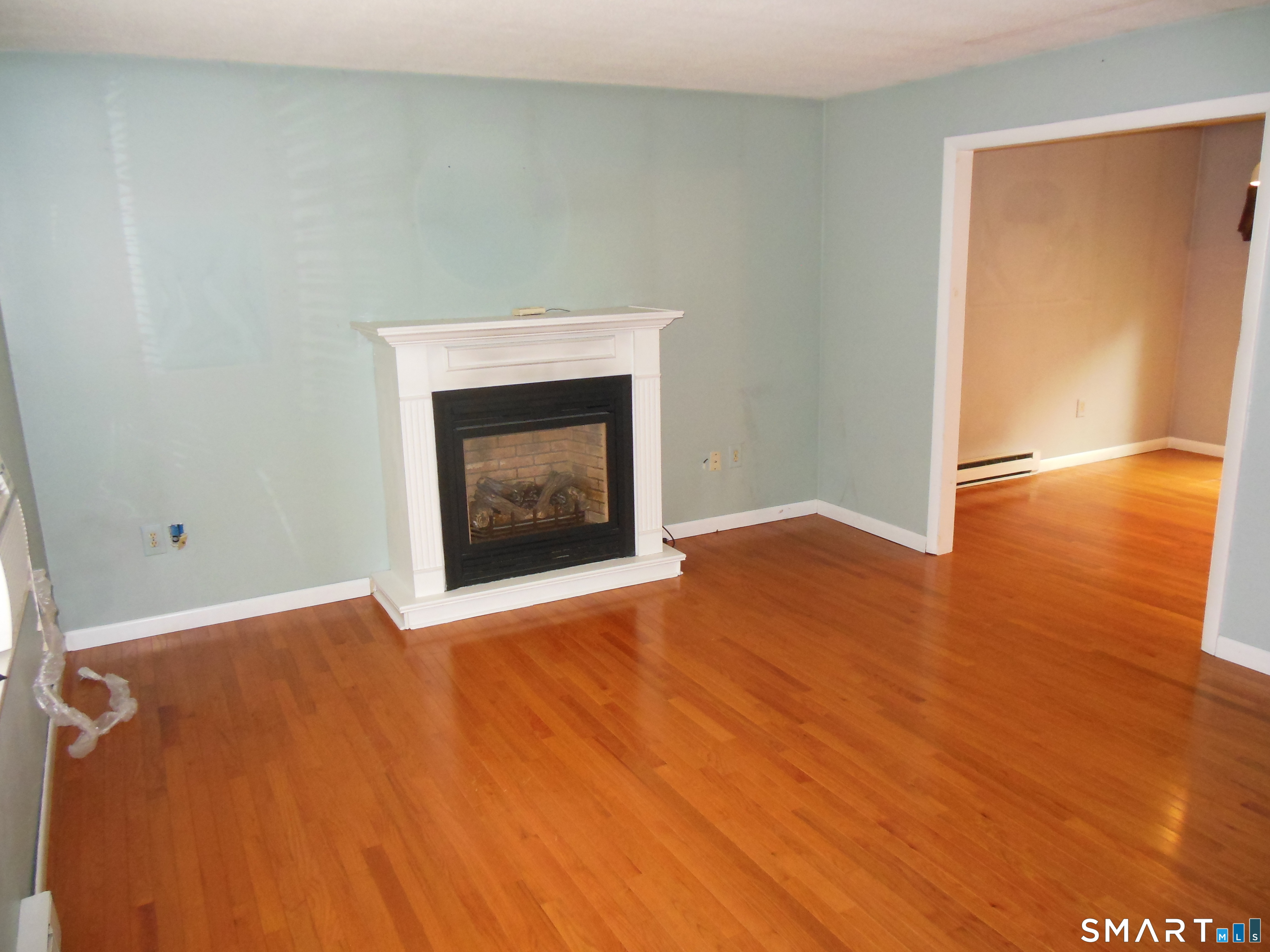 63 Midland Road Coventry, CT 06238 - Photo 5 of 37 LIVING ROOM SHOWING ENTRANCE TO DINING ROOM