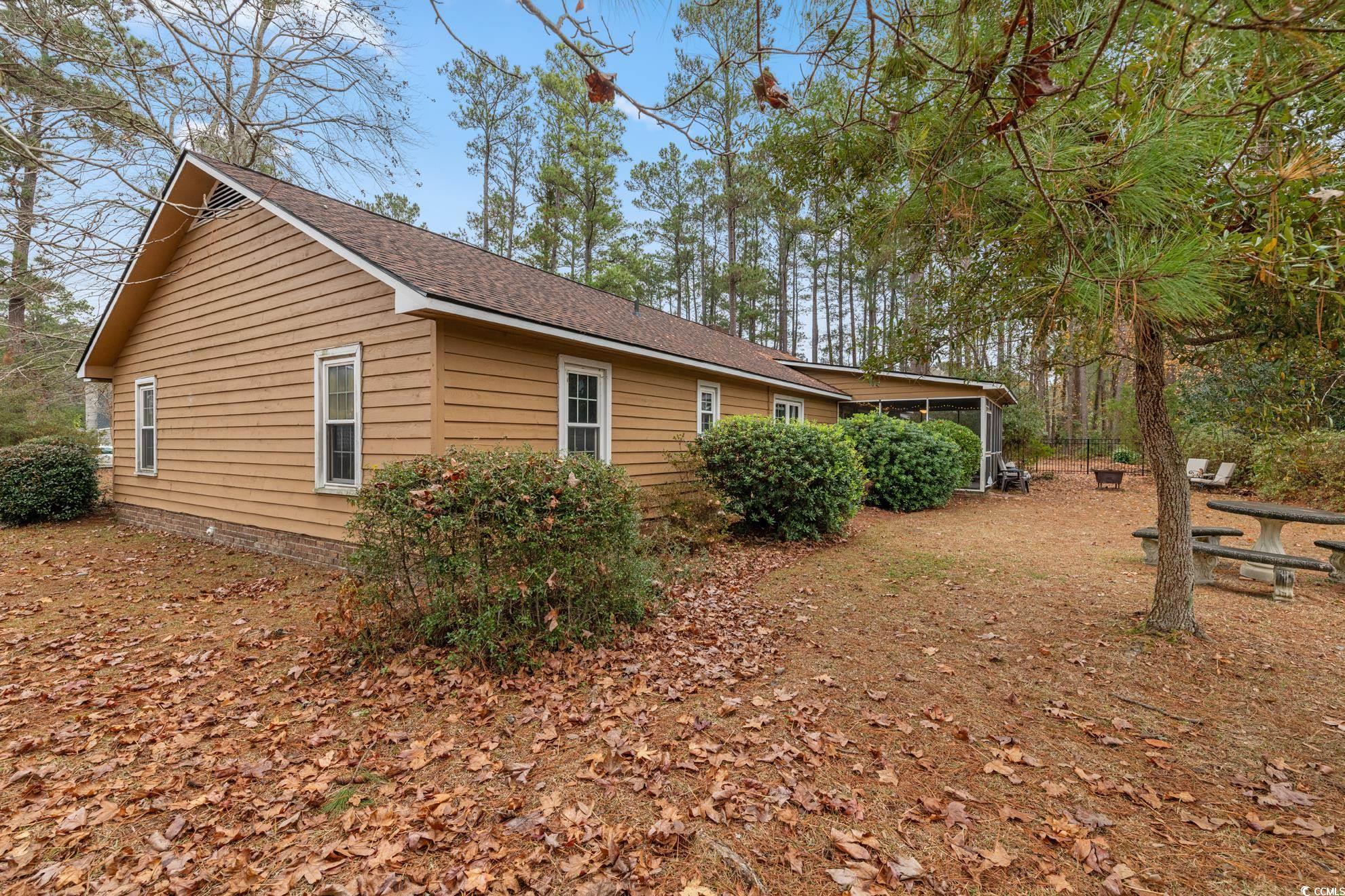 291 Francis Parker Road Georgetown, SC 29440 - Photo 18 of 28 View of side of property featuring a sunroom and a