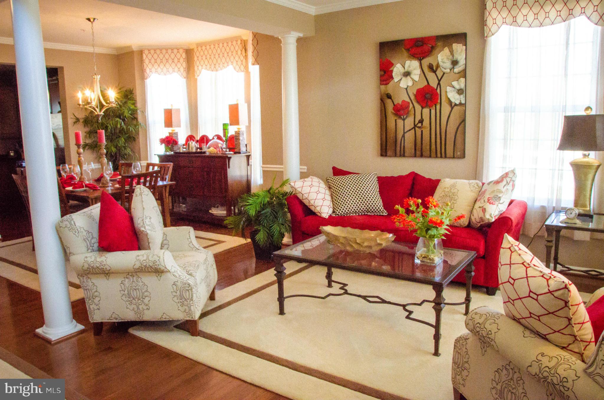 826 Salvatore Road Baltimore, MD 21220 - Photo 2 of 30 a living room with furniture and a painting on the wall