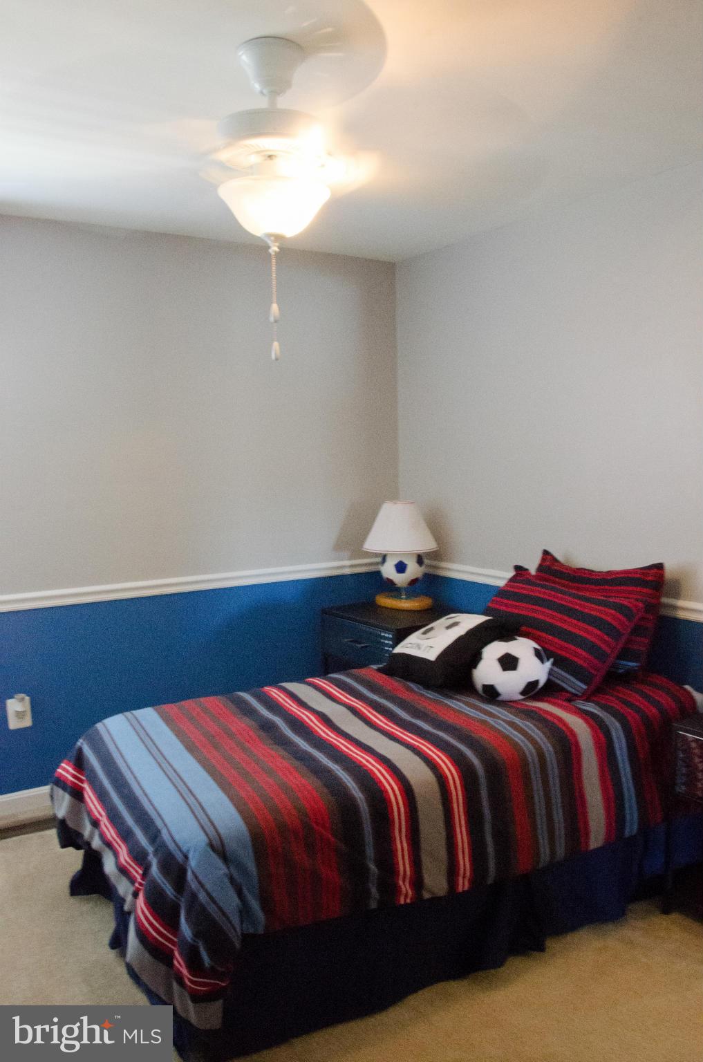826 Salvatore Road Baltimore, MD 21220 - Photo 20 of 30 a bedroom with a bed and a chandelier