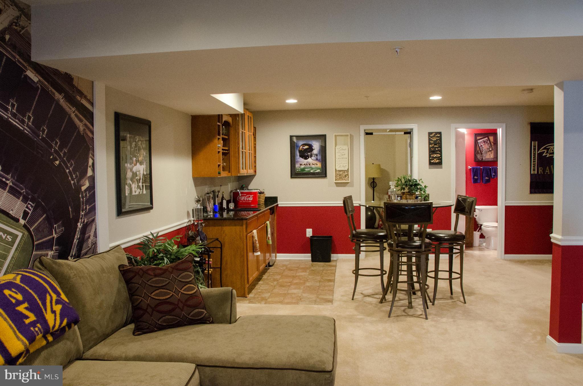 826 Salvatore Road Baltimore, MD 21220 - Photo 22 of 30 a living room with furniture and a dining table with bookshelf