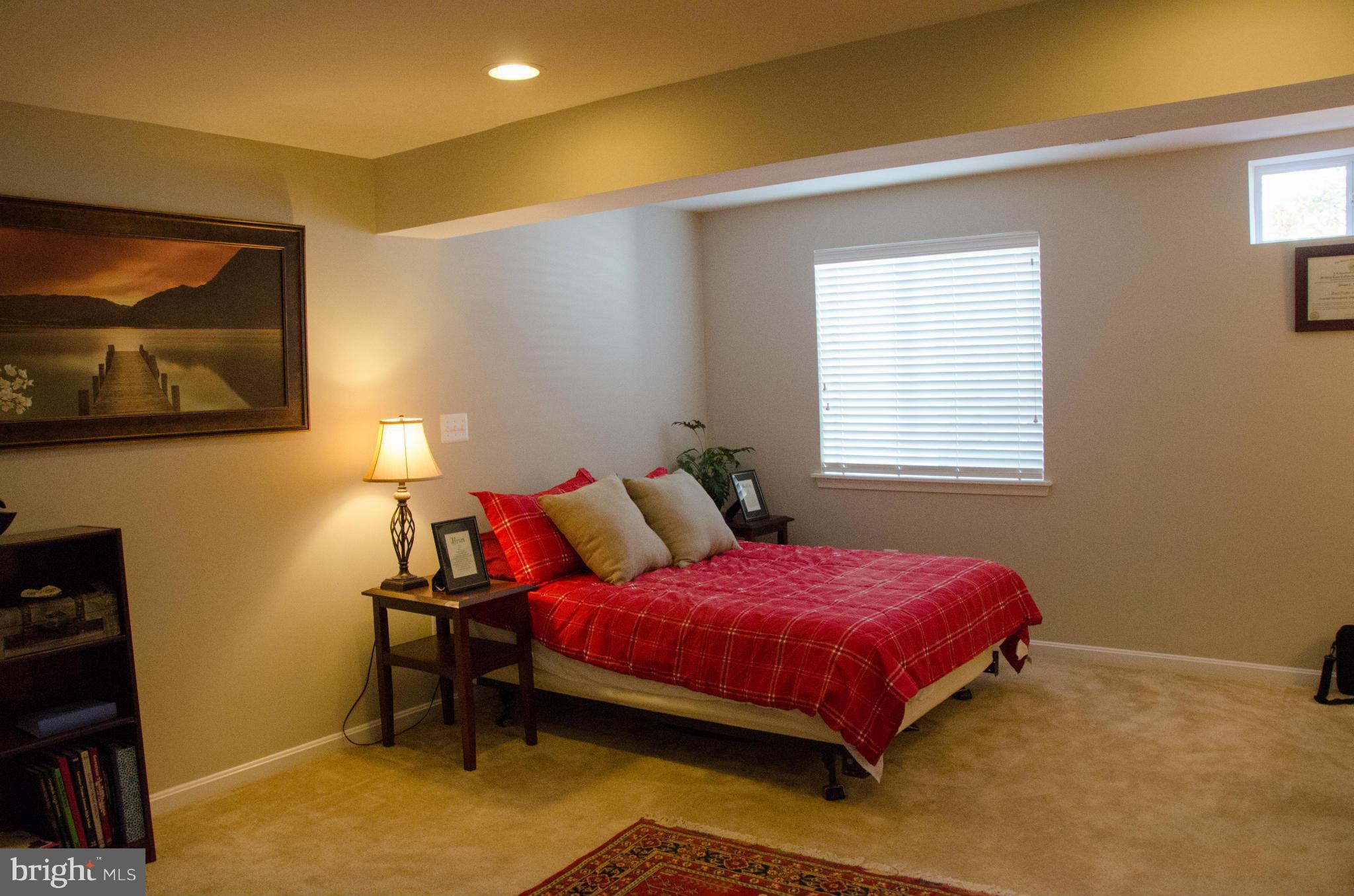 826 Salvatore Road Baltimore, MD 21220 - Photo 25 of 30 a bedroom with a bed and a desk