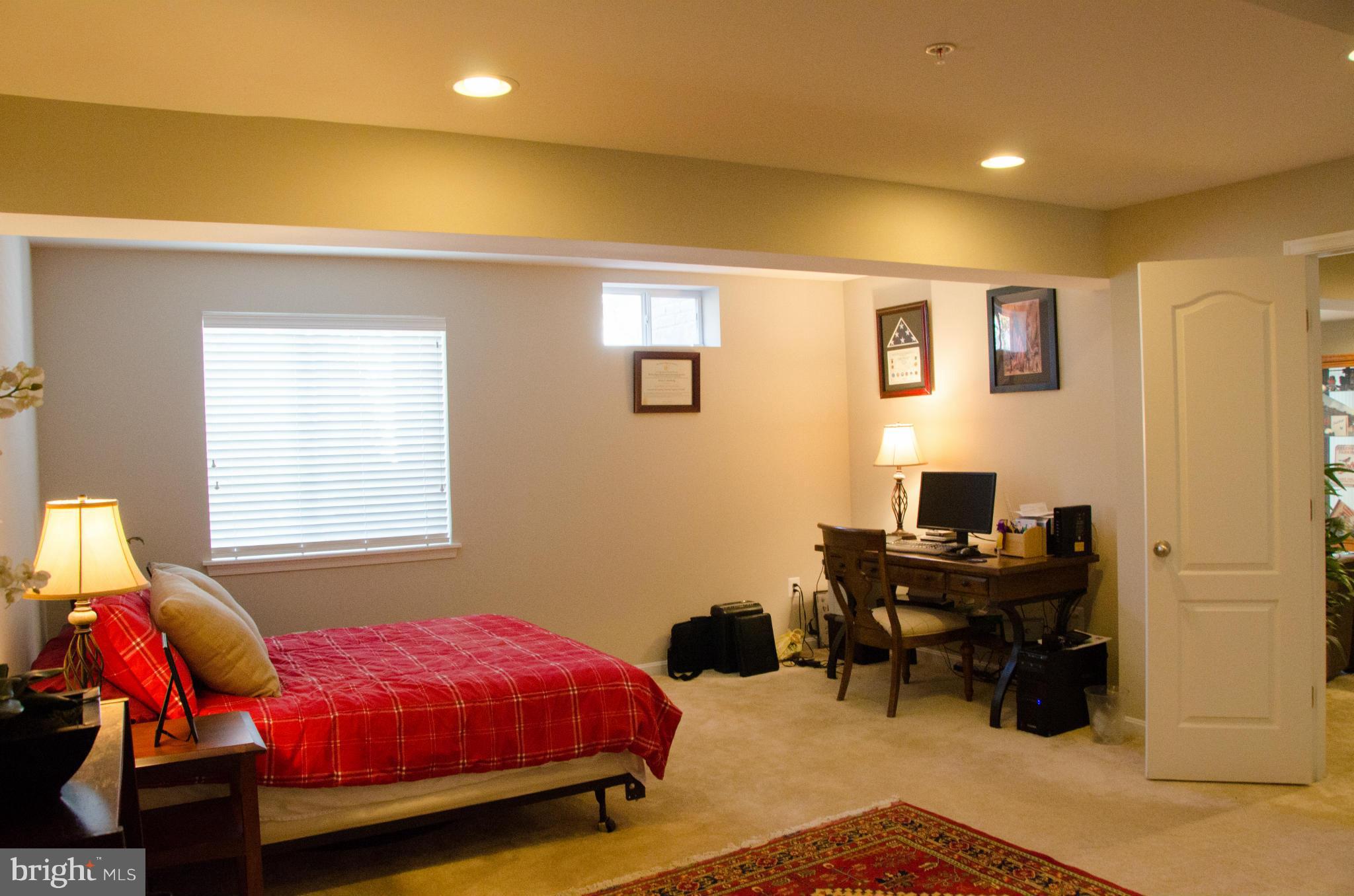 826 Salvatore Road Baltimore, MD 21220 - Photo 26 of 30 a bedroom with a bed and a window