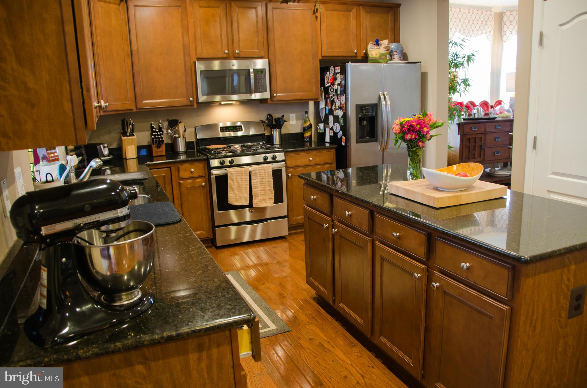 826 Salvatore Road Baltimore, MD 21220 - Photo 4 of 30 a kitchen with a sink appliances and cabinets