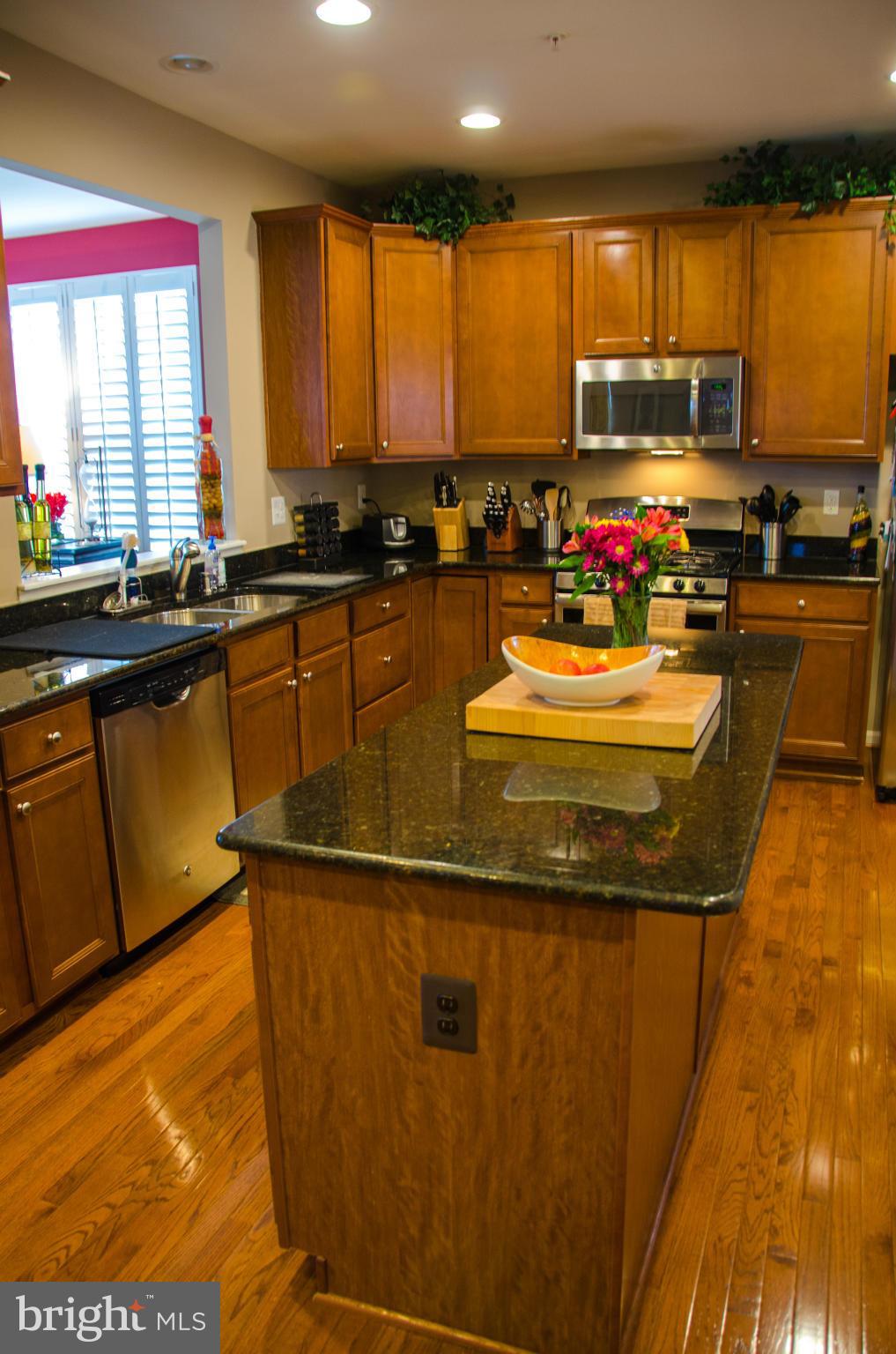 826 Salvatore Road Baltimore, MD 21220 - Photo 5 of 30 a kitchen with sink a window and appliances