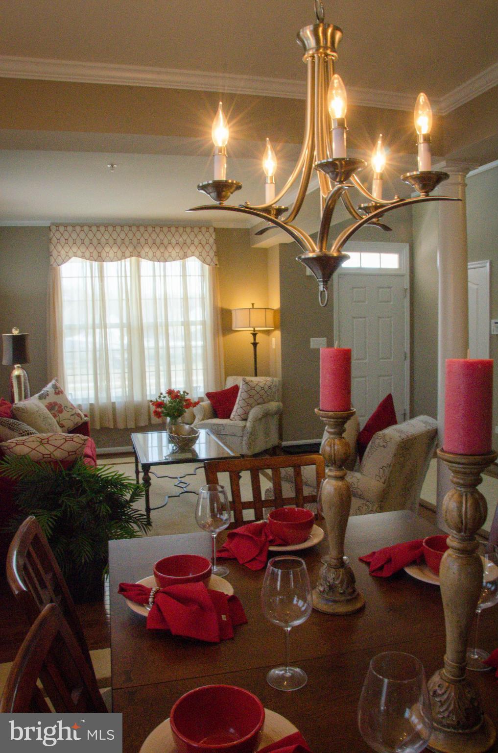 826 Salvatore Road Baltimore, MD 21220 - Photo 6 of 30 a living room with furniture and a chandelier