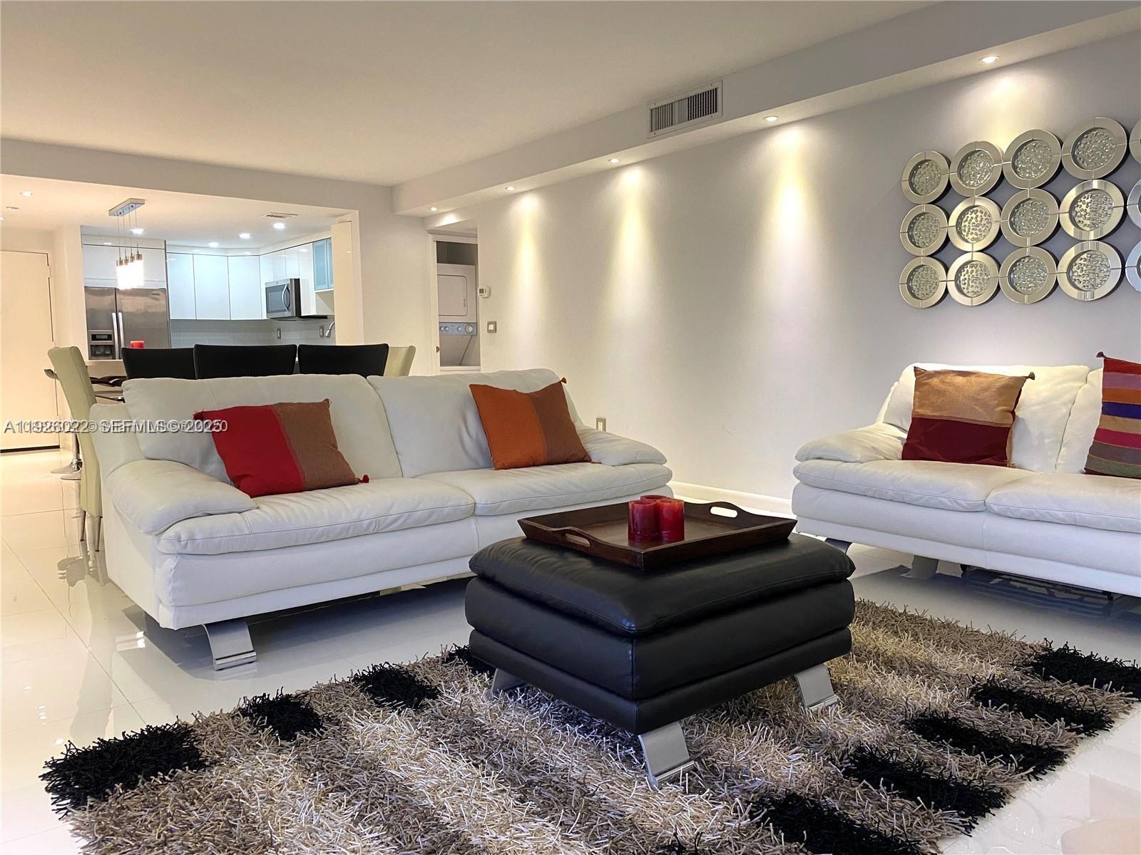 3731 North Country Club Drive, Unit 623 Aventura, FL 33180 - Photo 13 of 30 a living room with furniture and a couch