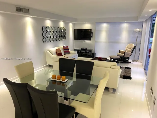 a workspace with furniture and a flat screen tv