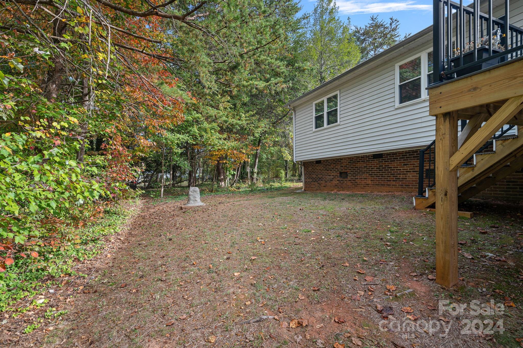 7505 Sarah Drive Denver, NC 28037 - Photo 26 of 34 a view of a house with a yard and tree