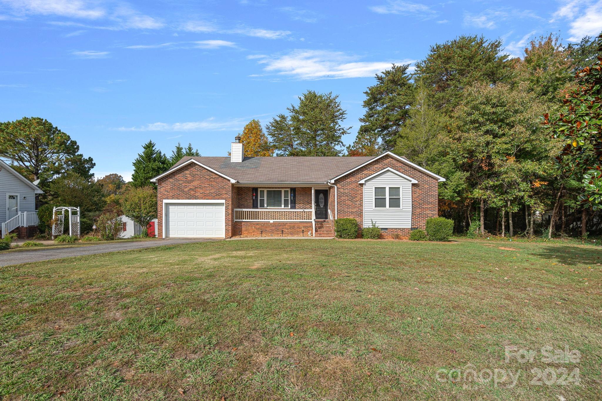 7505 Sarah Drive Denver, NC 28037 - Photo 34 of 34 a front view of a house with a yard and trees