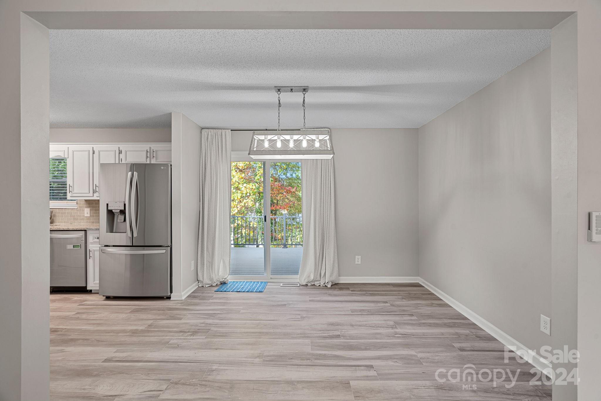 7505 Sarah Drive Denver, NC 28037 - Photo 4 of 34 a view of an empty room with a window