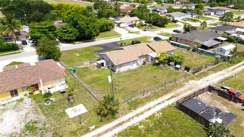 1940 48th Street Southwest Naples, FL 34116 - Photo 9 of 33 Property with a tan shingle roof and white exterior siding