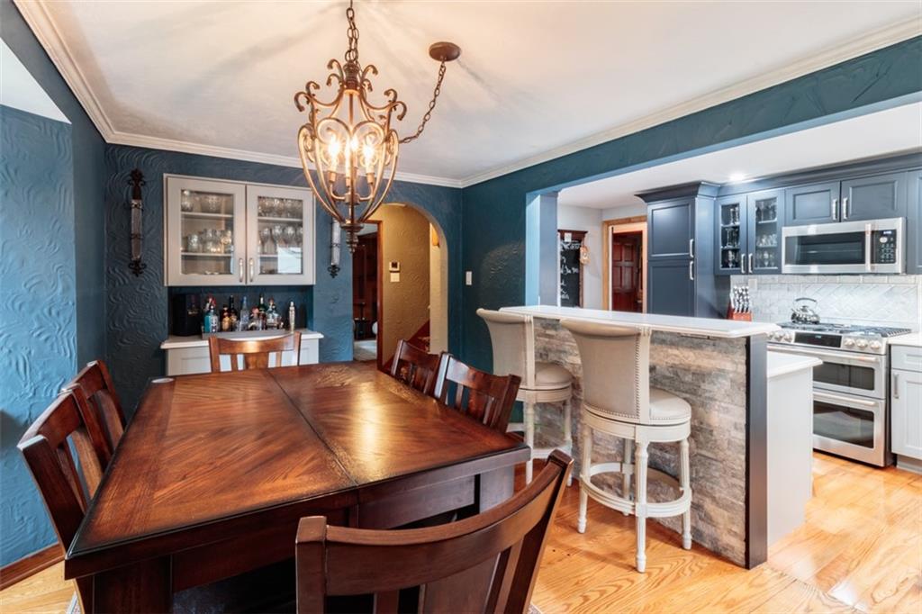 3239 Comanche Road Pittsburgh, PA 15241 - Photo 11 of 25 a view of a dining room with furniture and chandelier