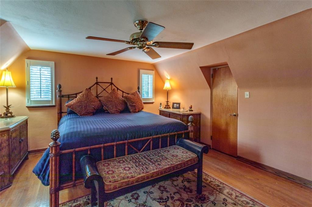 3239 Comanche Road Pittsburgh, PA 15241 - Photo 15 of 25 a bedroom with a bed and wooden cabinets