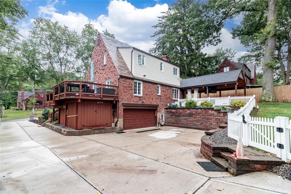 3239 Comanche Road Pittsburgh, PA 15241 - Photo 24 of 25 a front view of a house with a garden