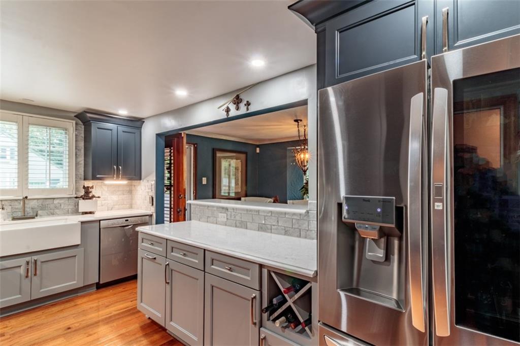 3239 Comanche Road Pittsburgh, PA 15241 - Photo 8 of 25 a large kitchen with a large window and stainless steel appliances
