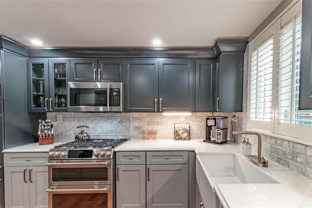 3239 Comanche Road Pittsburgh, PA 15241 - Photo 10 of 25 a kitchen with stainless steel appliances a stove sink and microwave