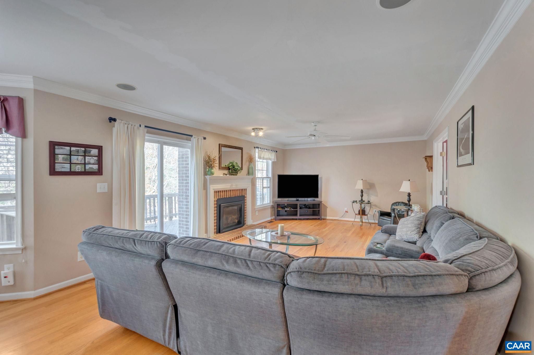 1642 Old Brook Road Charlottesville, VA 22901 - Photo 15 of 42 a living room with furniture and a flat screen tv