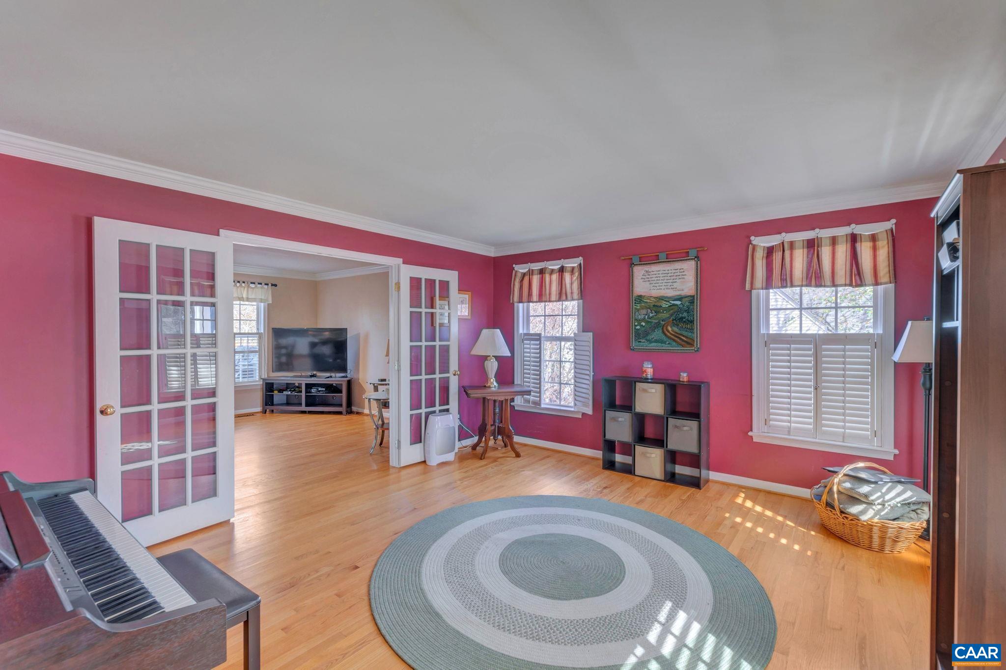 1642 Old Brook Road Charlottesville, VA 22901 - Photo 19 of 42 a living room with furniture and floor to ceiling window