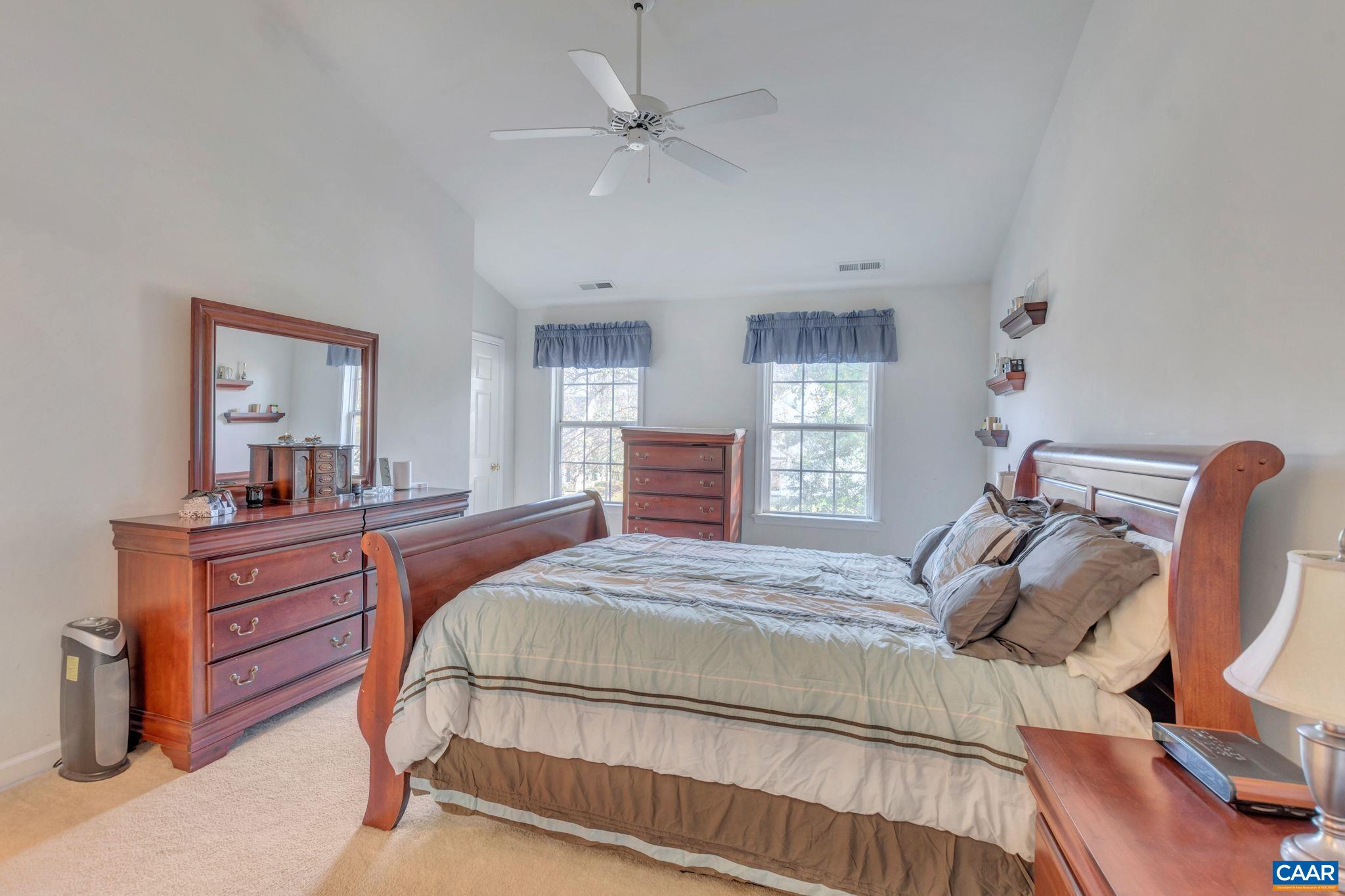 1642 Old Brook Road Charlottesville, VA 22901 - Photo 22 of 42 a bedroom with a bed and a dresser