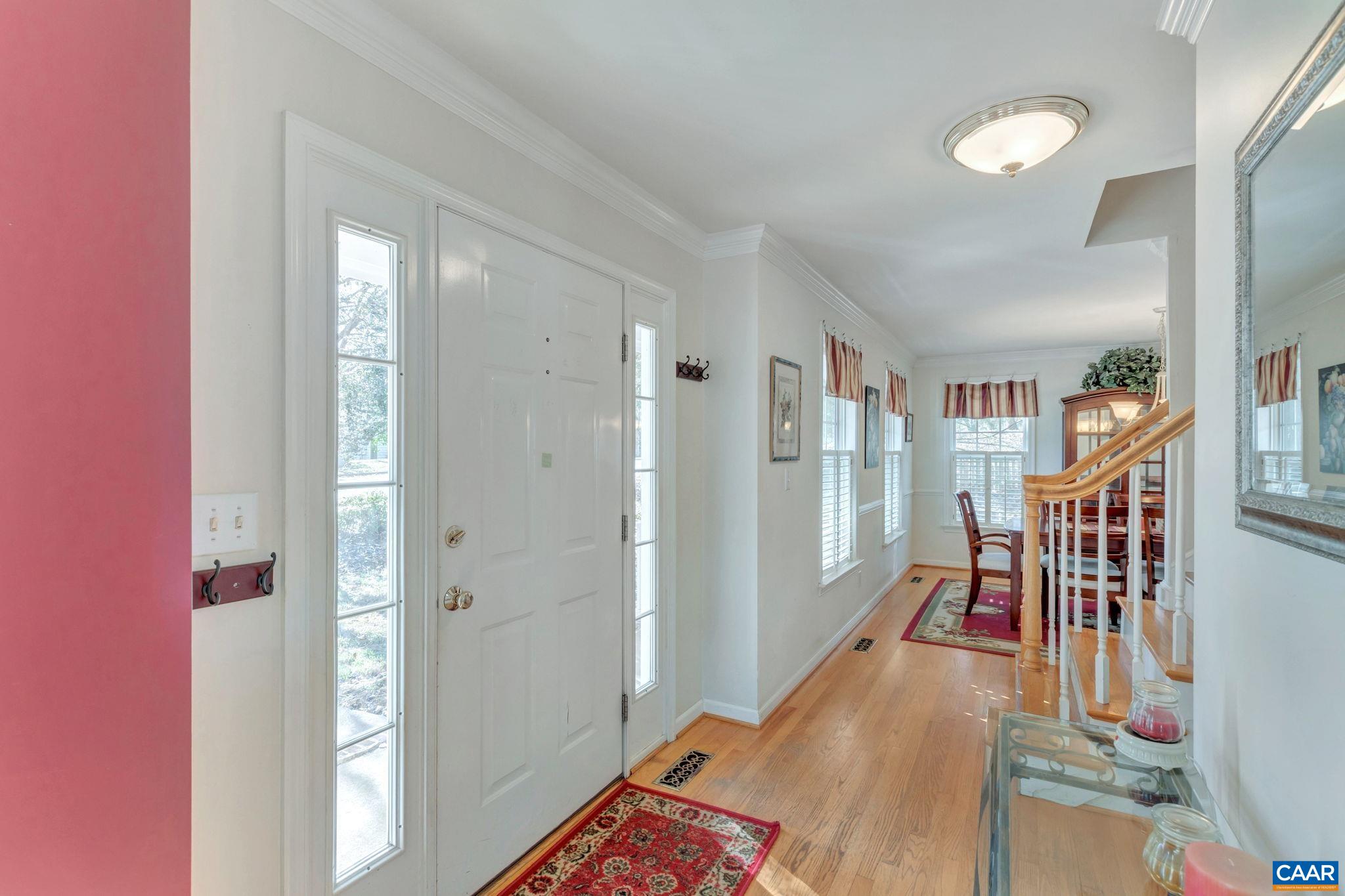 1642 Old Brook Road Charlottesville, VA 22901 - Photo 6 of 42 a very nice looking room with wooden floor and a bathroom