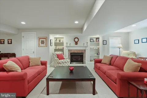a living room with furniture a couch and a fireplace
