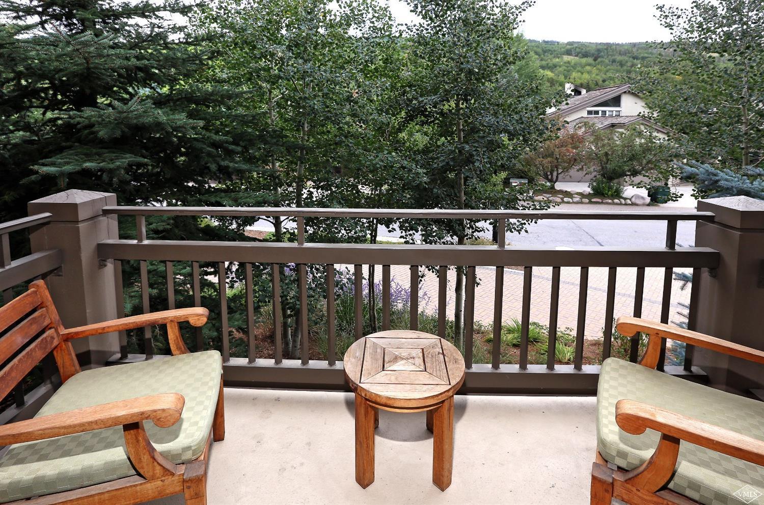 1 Vail Road, Unit 4103 Vail, CO 81657 - Photo 1 of 19 a view of a chairs and table in the roof deck