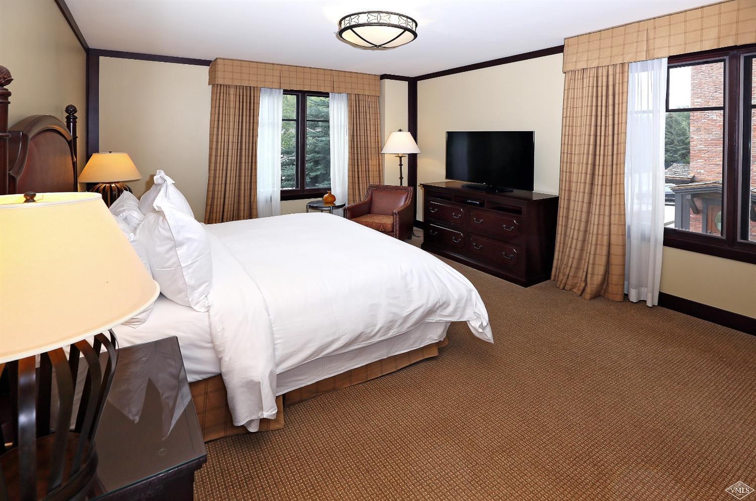 1 Vail Road, Unit 4103 Vail, CO 81657 - Photo 13 of 19 a bedroom with bed tv and window