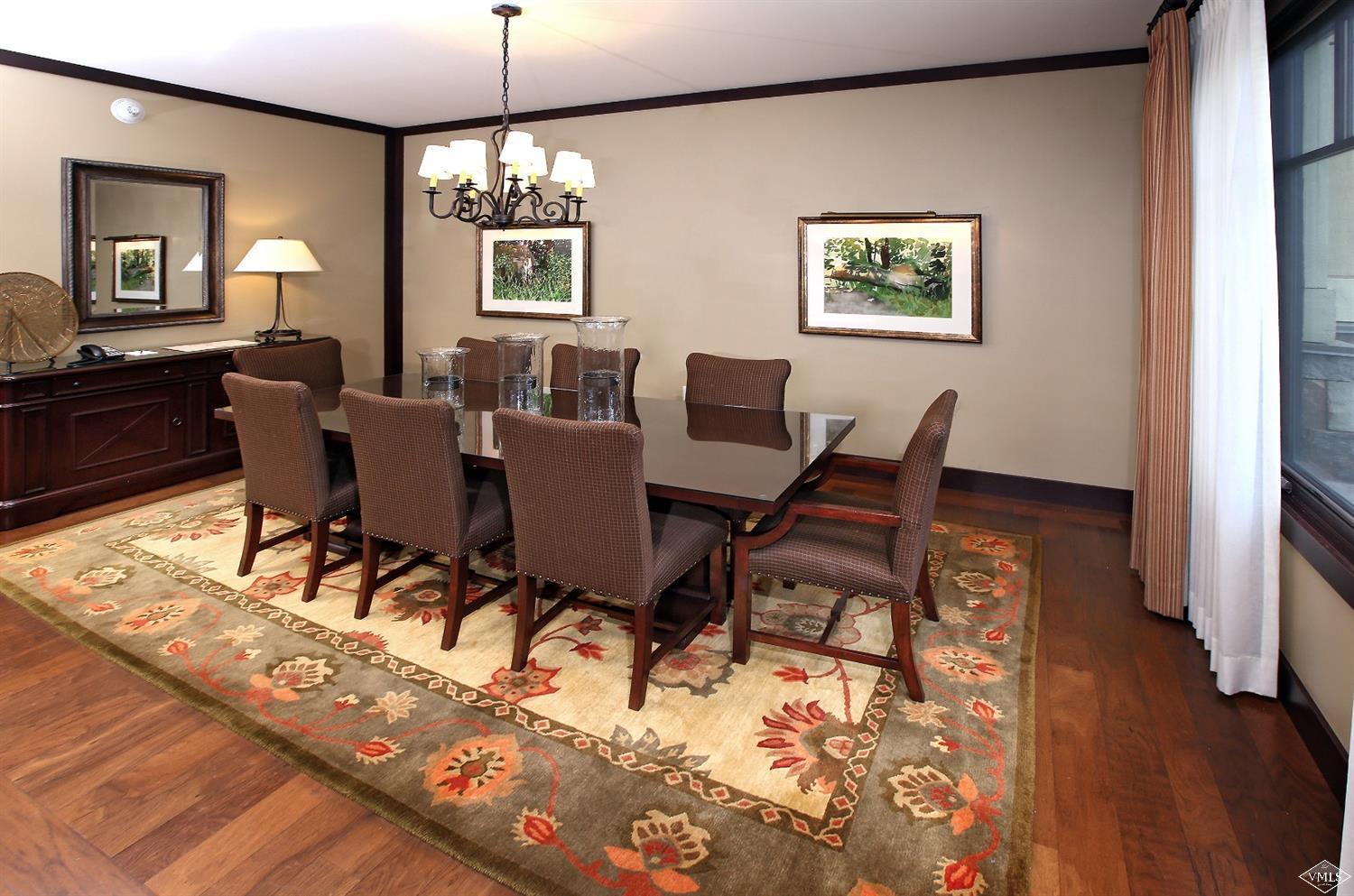 1 Vail Road, Unit 4103 Vail, CO 81657 - Photo 6 of 19 a view of a dining room with furniture window and wooden floor