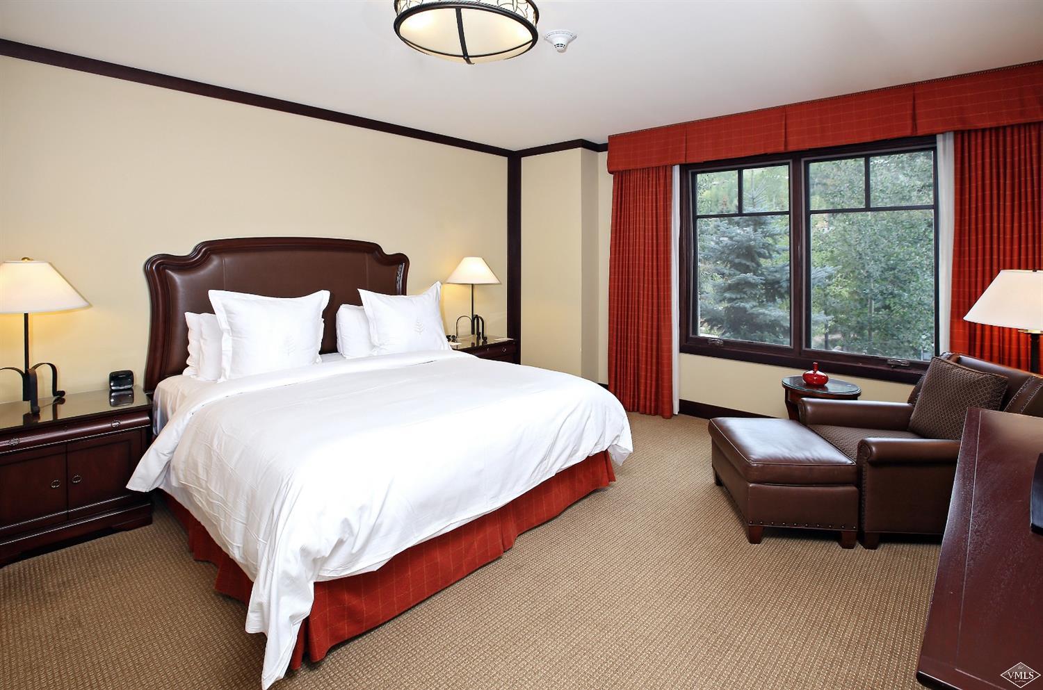 1 Vail Road, Unit 4103 Vail, CO 81657 - Photo 10 of 19 a bedroom with bed and a large window
