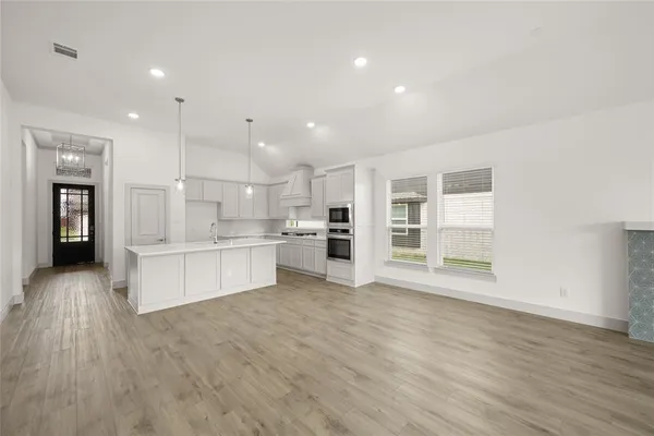 a view of kitchen with wooden floor
