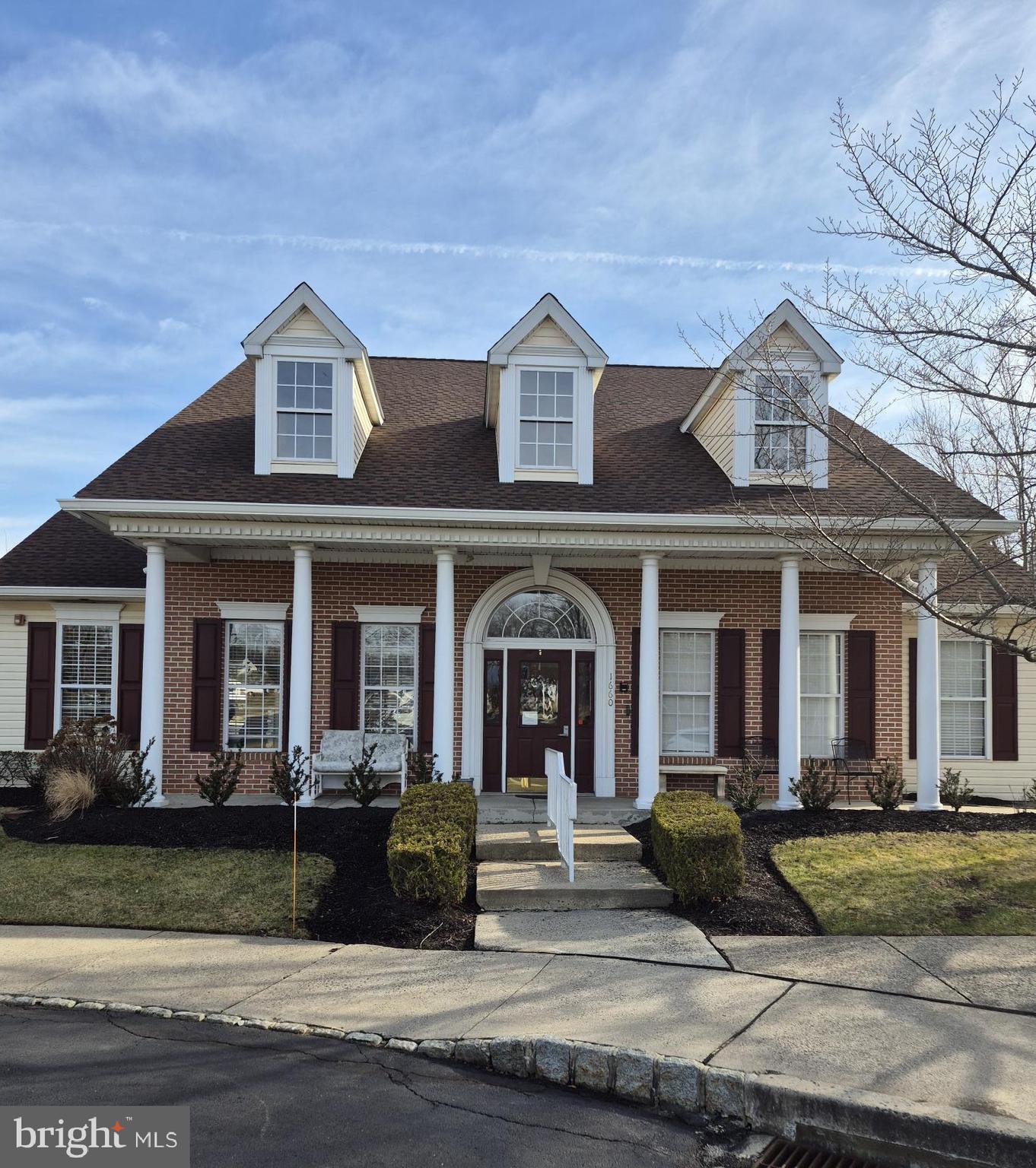 1782 Gibson Road Bensalem, PA 19020 - Photo 21 of 33 a view of a white house with large windows and a table and chairs in a yard