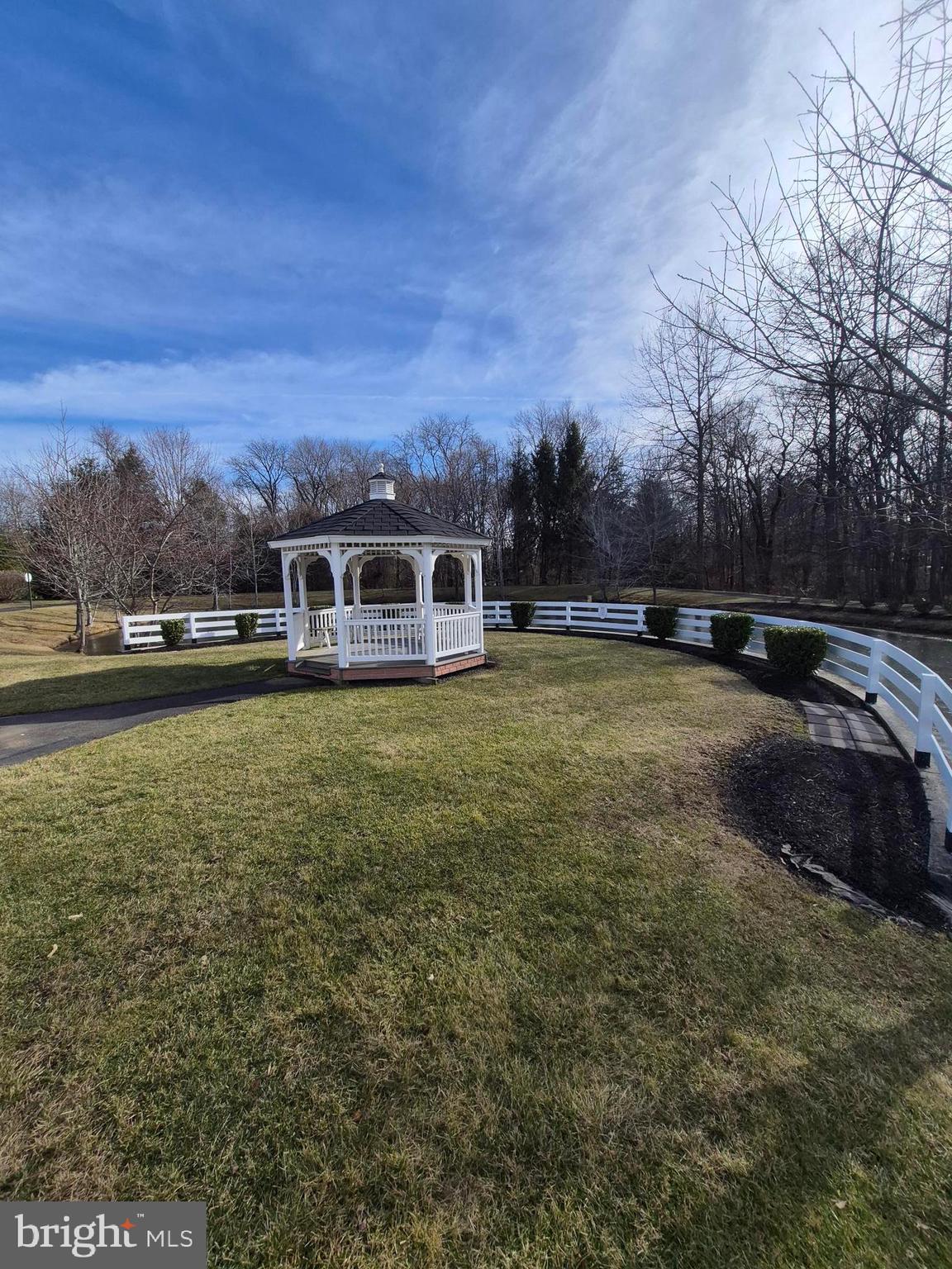 1782 Gibson Road Bensalem, PA 19020 - Photo 22 of 33 a view of a large pool with lawn chairs and large trees