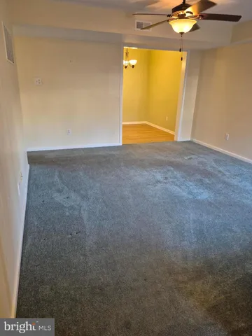 an empty room with a empty space and windows