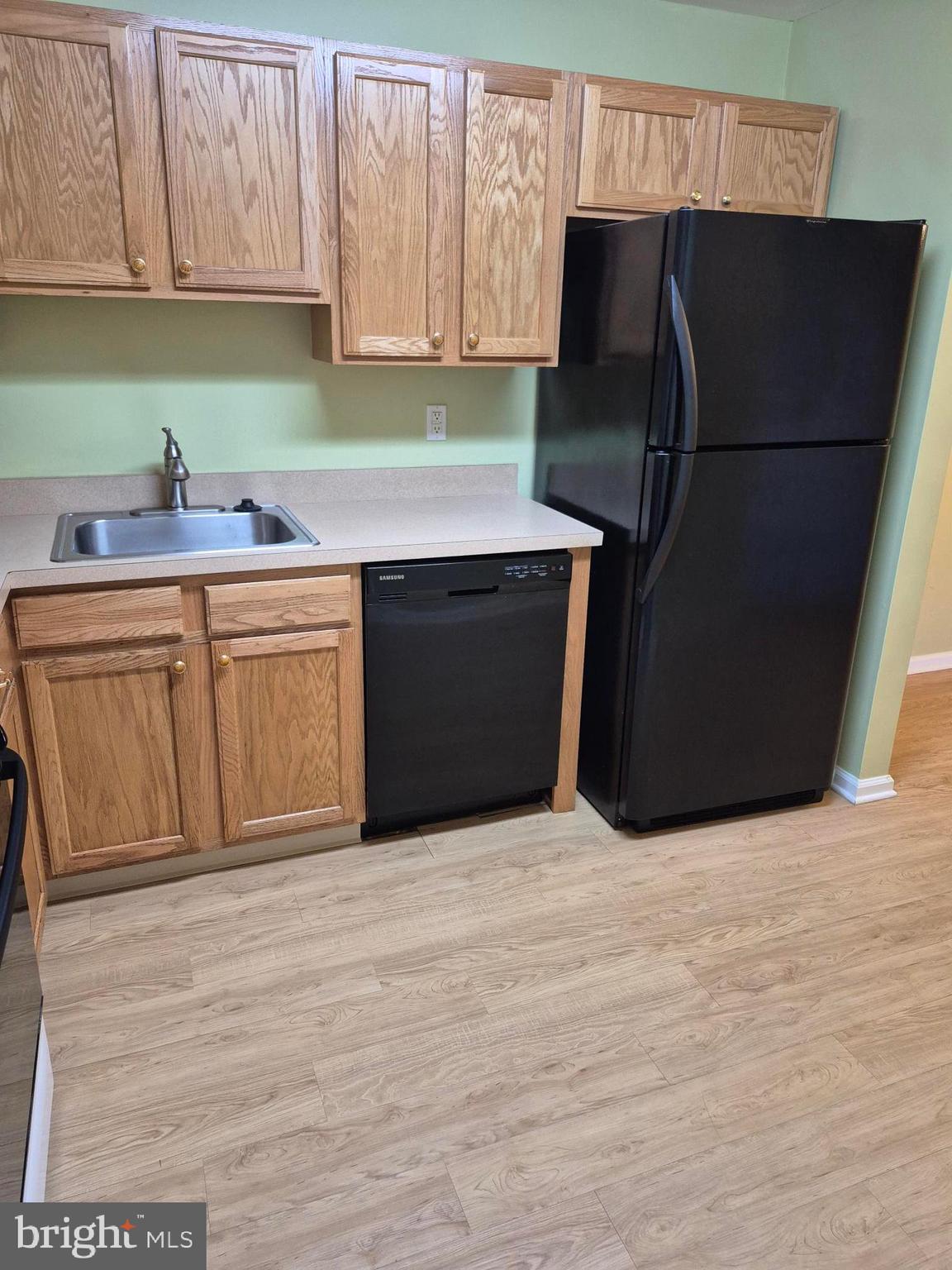 1782 Gibson Road Bensalem, PA 19020 - Photo 7 of 33 a kitchen with stainless steel appliances white cabinets and a refrigerator
