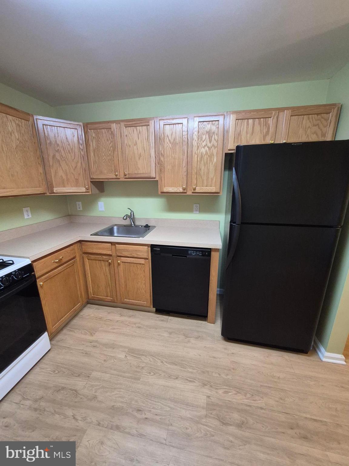 1782 Gibson Road Bensalem, PA 19020 - Photo 9 of 33 a kitchen with a sink and a refrigerator