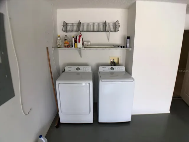 a utility room with dryer and washer