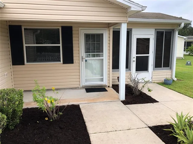 a view of a entryway with flower pots