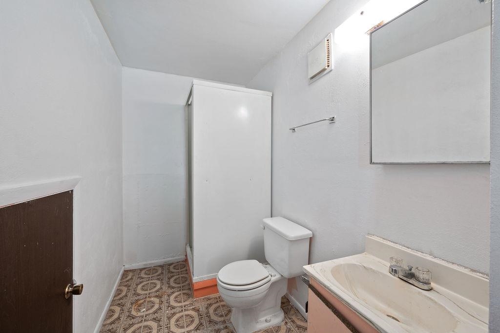 631-29 29 1/4 Road Grand Junction, CO 81504 - Photo 6 of 11 a white toilet sitting next to a bathroom sink