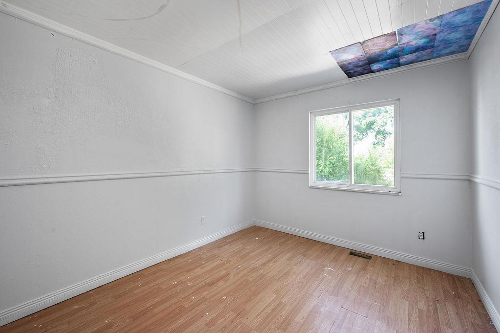 631-29 29 1/4 Road Grand Junction, CO 81504 - Photo 8 of 11 an empty room with wooden floor and windows